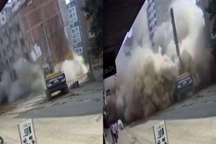 Ağır hasarlı bina tek dokunuşla toz bulutuna döndü haberinin görseli