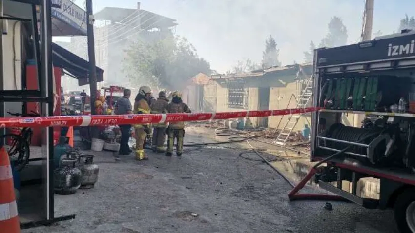 Karabağlar'da içerisinde mutfak tüplerinin de bulunduğu market deposunda çıkan yangın korku dolu anlar yaşattı