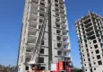 Mersin’de 13. katta mahsur kalan işçileri itfaiye 54 metrelik merdivenle kurtardı