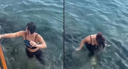 Ünlü şarkıcı denize düşen telefonunu kurtarmak için suya daldı