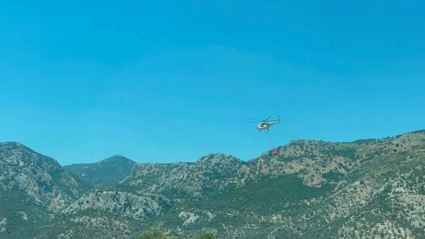 Muğla Seydikemer’de orman yangınına havadan ve karadan müdahale haberinin görseli