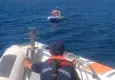 İzmir'de denizde sürüklenen lastik bottaki kişi ve çocuk kurtarıldı