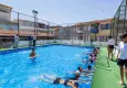 Başkan Tugay yüzme öğrenen çocukların heyecanına ortak oldu
